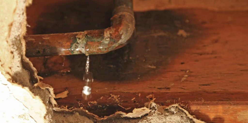 What causes the dripping sound behind my wall