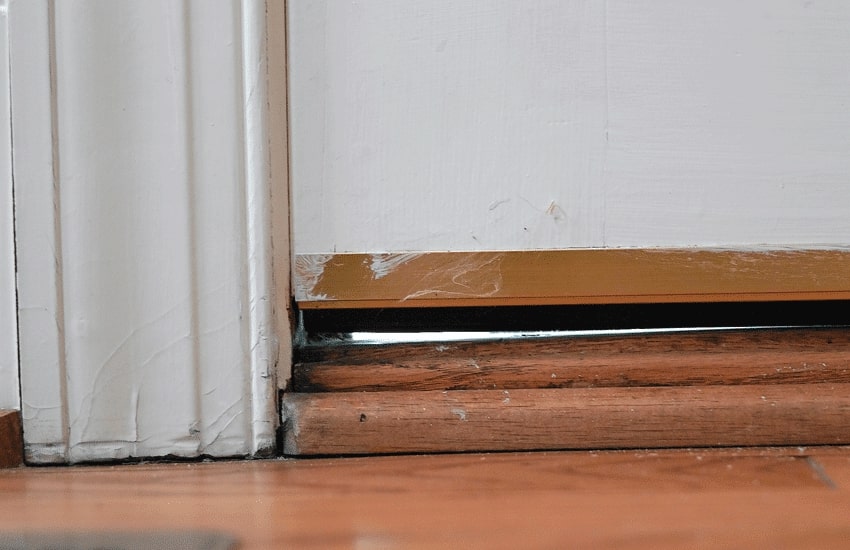 Repair damaged weatherstripping or thresholds